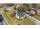 Beautiful aerial view shows property's spacious fenced yard, mature trees, and classic design at 1310 S 8Th St, Lillington, NC 27546