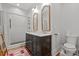 Stylish bathroom with double vanity, framed mirrors, hexagon tiled shower, and fixtures at 1310 S 8Th St, Lillington, NC 27546