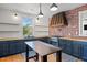 Stylish kitchen with custom cabinets, stainless steel appliances, brick backsplash, and wood countertops at 1310 S 8Th St, Lillington, NC 27546