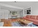 Spacious living room with a cozy seating area, hardwood floors, and connection to the adjacent dining area at 1310 S 8Th St, Lillington, NC 27546