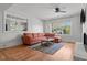 Cozy living room with hardwood floors, fireplace and a large window that allows plenty of natural light at 1310 S 8Th St, Lillington, NC 27546