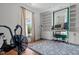 Bright room with a dedicated workspace and built-in shelving, plus a fitness machine at 1310 S 8Th St, Lillington, NC 27546