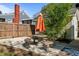 Cozy patio area featuring a stone table with umbrella and seating, perfect for outdoor dining and entertaining at 1310 S 8Th St, Lillington, NC 27546