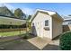 Outdoor shed with a covered carport, providing extra storage and parking space in the well-maintained backyard at 1310 S 8Th St, Lillington, NC 27546