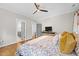 Bedroom with hardwood floors, a ceiling fan, and gray trim at 1515 E Jones St, Raleigh, NC 27610