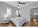 Bright bedroom with hardwood floors, natural light, and a boat shelf at 1515 E Jones St, Raleigh, NC 27610