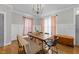 Elegant dining area with modern chandelier, hardwood floors, and natural light at 1515 E Jones St, Raleigh, NC 27610