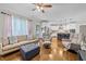 Open-concept living room flows into a kitchen with hardwood floors and ample seating at 1515 E Jones St, Raleigh, NC 27610