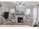 Cozy living room features a fireplace, built-in shelving, and comfortable seating at 1515 E Jones St, Raleigh, NC 27610