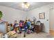 Bedroom with personal items, walker, desk and chair in an unfinished state at 1525 Rogers Rd, Graham, NC 27253