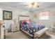 Bright bedroom boasts a plush bed with floral patterned linens and coordinating furniture at 1525 Rogers Rd, Graham, NC 27253