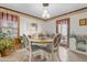 Cozy dining room featuring a round table, ample natural light, and warm wood accents at 1525 Rogers Rd, Graham, NC 27253