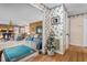Inviting living room with a blend of cozy wood paneling and cheerful floral wallpaper at 1525 Rogers Rd, Graham, NC 27253