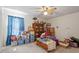 This bedroom provides ample storage with a large bookcase, though could use some organization at 153 Glenn Oak Dr, Sanford, NC 27332