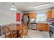 Eat-in kitchen featuring stainless steel appliances and wood cabinets at 153 Glenn Oak Dr, Sanford, NC 27332