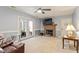 Comfortable living room has fireplace, access to outside, and is ready for new decor at 153 Glenn Oak Dr, Sanford, NC 27332