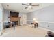 Spacious living room with fireplace, tv, access to outdoor, neutral colors, and ceiling fan at 153 Glenn Oak Dr, Sanford, NC 27332
