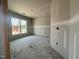 Unfinished bedroom featuring a large window, grey walls, and white trim at 1547 Pecan Drive # 31, Nashville, NC 27856
