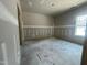 Unfinished bedroom with grey walls, white trim, and natural light at 1547 Pecan Drive # 31, Nashville, NC 27856
