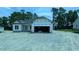 New construction home featuring an attached two car garage in a residential area at 1547 Pecan Drive # 31, Nashville, NC 27856
