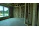 Interior view of new construction home with wood framing, insulation, concrete flooring and window at 1547 Pecan Drive # 31, Nashville, NC 27856