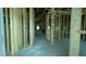 Spacious interior view of new construction home featuring wood framing and concrete flooring at 1547 Pecan Drive # 31, Nashville, NC 27856