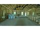 Spacious interior view of new construction home featuring wood framing and concrete flooring at 1547 Pecan Drive # 31, Nashville, NC 27856