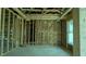 Interior view of new construction home with wood framing, insulation, concrete flooring and window at 1547 Pecan Drive # 31, Nashville, NC 27856