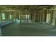 Spacious interior view of new construction home featuring wood framing and concrete flooring at 1547 Pecan Drive # 31, Nashville, NC 27856