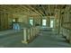Spacious interior view of new construction home featuring wood framing and concrete flooring at 1547 Pecan Drive # 31, Nashville, NC 27856