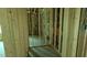 Interior view of new construction home with wood framing, concrete flooring and exposed utilities at 1547 Pecan Drive # 31, Nashville, NC 27856