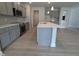 Modern kitchen featuring gray cabinets, granite countertops, stainless steel appliances, and center island at 1547 Pecan Drive # 31, Nashville, NC 27856