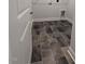 A gray tiled laundry room with connections for a washer and dryer at 1547 Pecan Drive # 31, Nashville, NC 27856