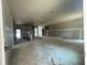 Unfinished living room featuring grey walls, white trim, and an open layout at 1547 Pecan Drive # 31, Nashville, NC 27856
