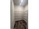 Pantry with dark tile floors and wire shelving, offering ample storage space at 1547 Pecan Drive # 31, Nashville, NC 27856