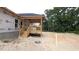 Image shows a new home under construction with a partially built back porch and wood railing at 1565 Pecan Drive # 30, Nashville, NC 27856