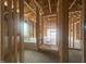 New construction framing reveals a home's bathroom with exposed ceiling joists at 1565 Pecan Drive # 30, Nashville, NC 27856