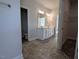 Bathroom view showcasing double vanity with grey tile floors and walk in closet at 1565 Pecan Drive # 30, Nashville, NC 27856