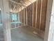 Unfinished bedroom with exposed framing and a window for natural light at 1565 Pecan Drive # 30, Nashville, NC 27856