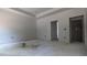 Unfinished bedroom showcasing modern recessed lighting and door frames at 1565 Pecan Drive # 30, Nashville, NC 27856