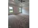 Spacious bedroom features neutral walls, plush carpeting, tray ceilings and a ceiling fan fixture at 1565 Pecan Drive # 30, Nashville, NC 27856