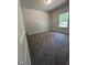Bedroom featuring neutral walls, plush carpeting, and natural light from the window at 1565 Pecan Drive # 30, Nashville, NC 27856
