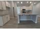 Bright kitchen featuring stainless appliances, granite countertops and island with seating at 1565 Pecan Drive # 30, Nashville, NC 27856