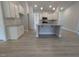 Bright kitchen featuring stainless appliances, granite countertops and island with seating at 1565 Pecan Drive # 30, Nashville, NC 27856