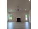 Inviting living room with fireplace, ceiling fan, and a door that leads to the exterior at 1565 Pecan Drive # 30, Nashville, NC 27856