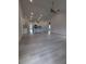 Spacious open-concept living space with light-colored flooring, kitchen island, and a high ceiling at 1565 Pecan Drive # 30, Nashville, NC 27856