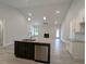 Open-concept living space showcasing the kitchen, dining, and living areas with modern finishes at 1565 Pecan Drive # 30, Nashville, NC 27856