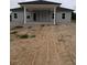 A rear exterior view shows a covered porch and the home's neutral-toned siding at 1565 Pecan Drive # 30, Nashville, NC 27856