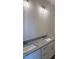 Bathroom vanity featuring a double sink and granite countertop at 161 Jones Creek Ln, Lillington, NC 27546