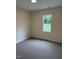 Cozy bedroom with neutral walls, carpet and window at 161 Jones Creek Ln, Lillington, NC 27546